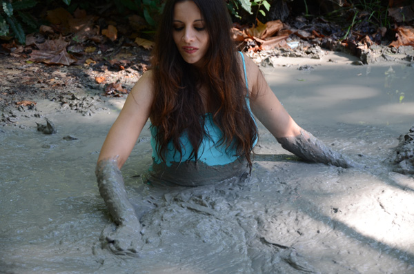 Stefani pays a cave girl with a thing for deep mud. 